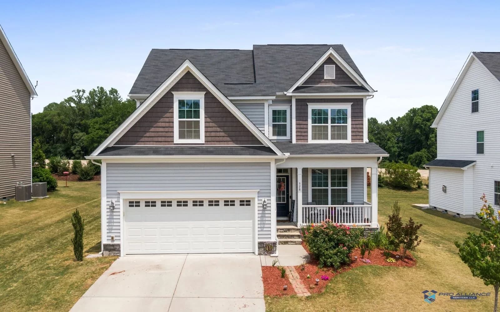 A driveway leading up to a suburban single-family home