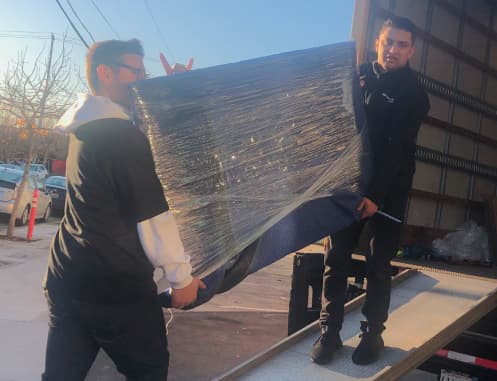 Movers carrying belongings