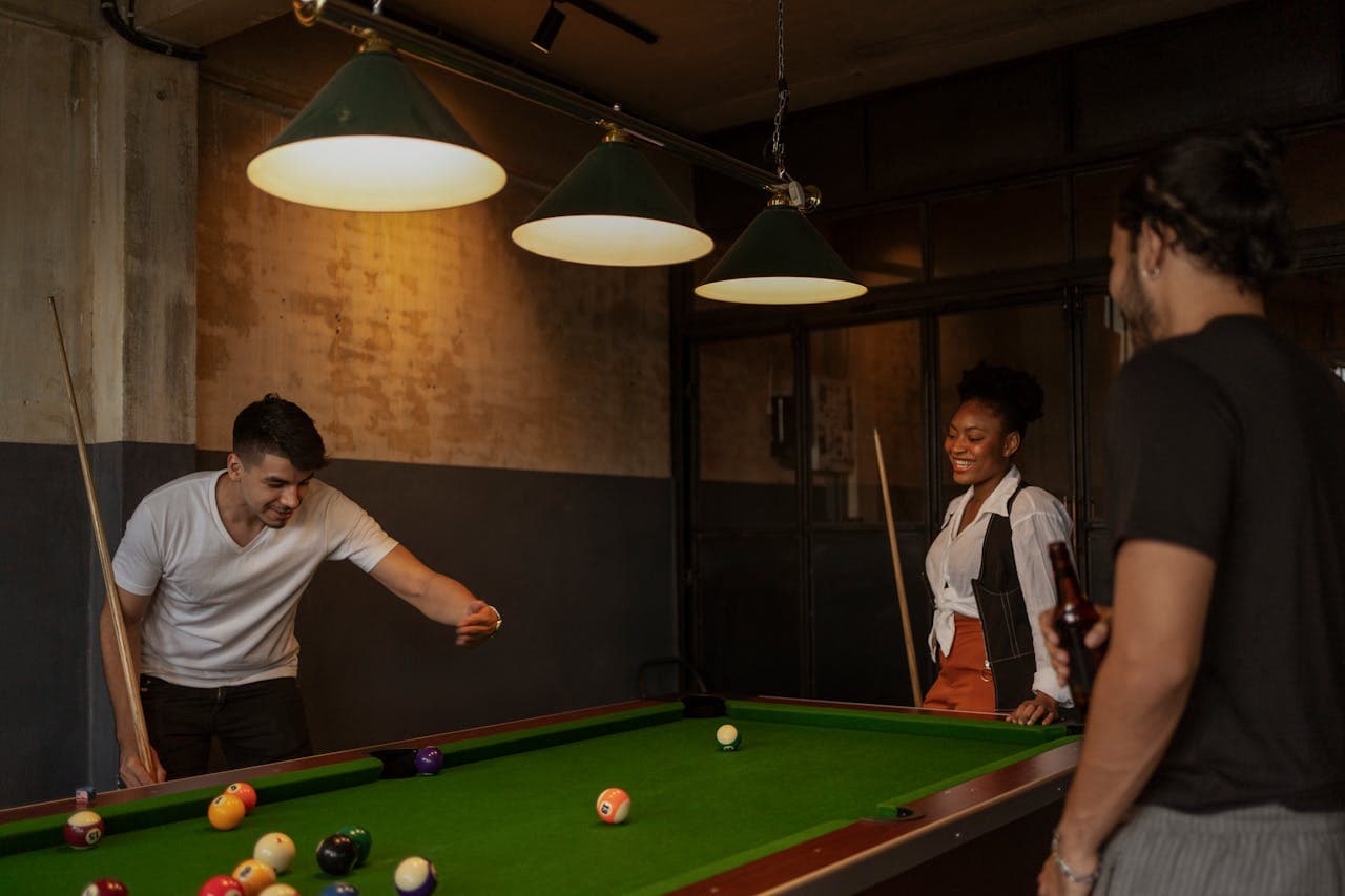 A group of friends playing pool
