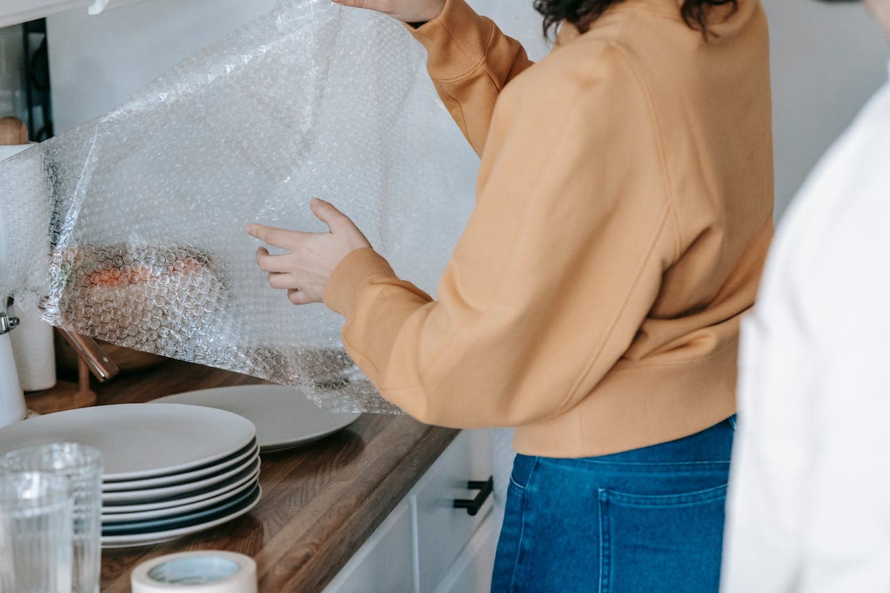 A woman packing plates