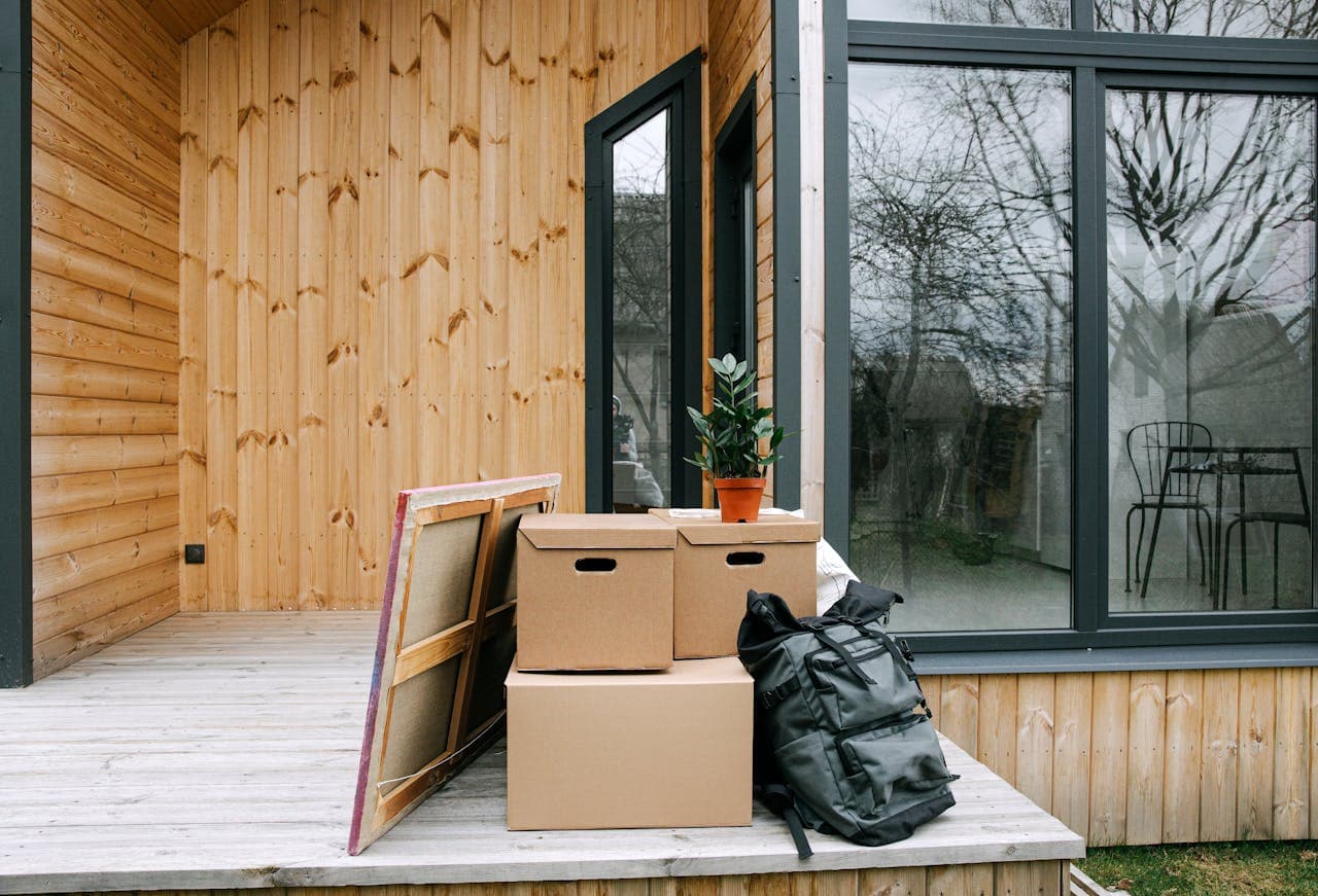 Packing supplies for moving to Helotes on the wooden porch