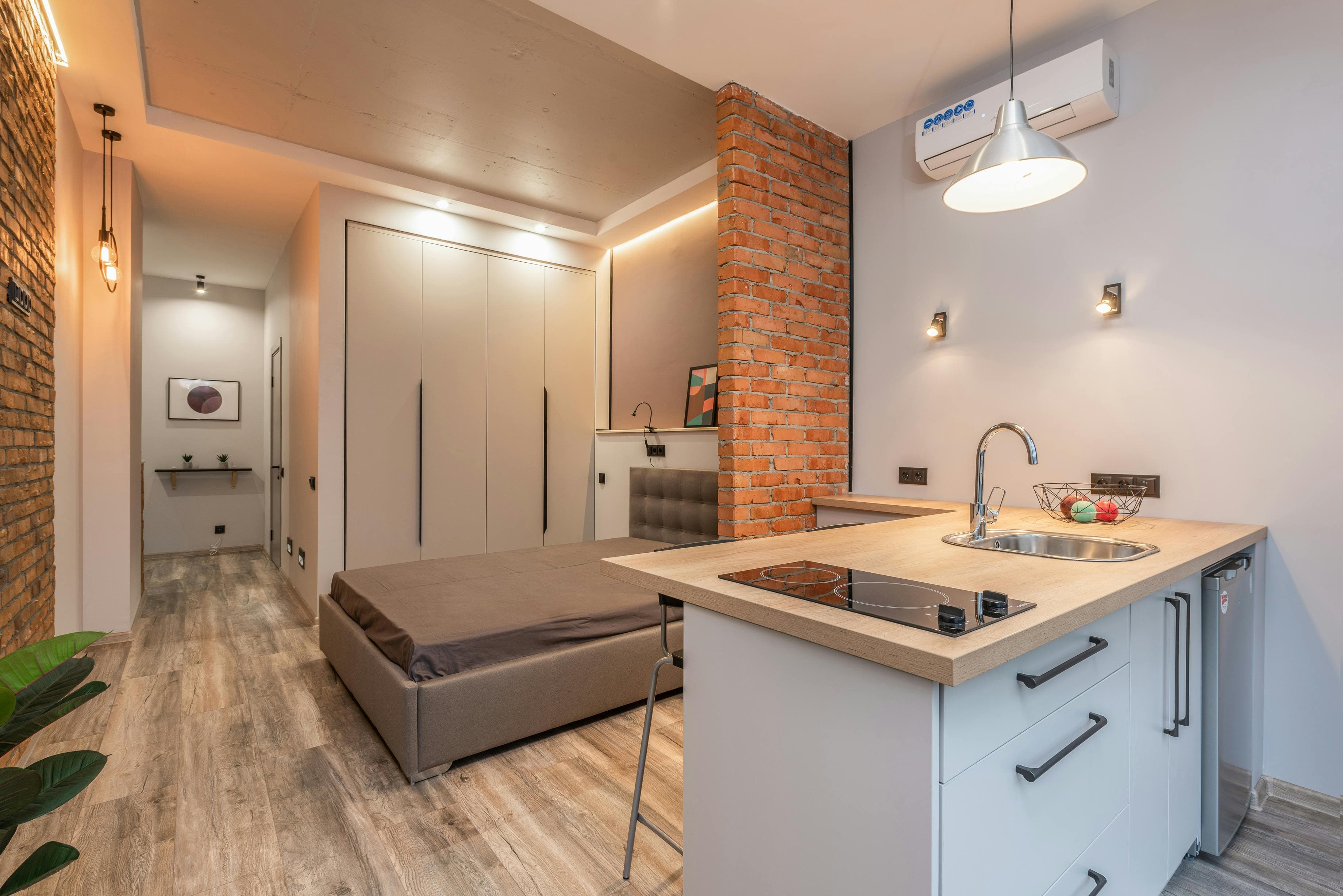 Interior modern apartment with kitchen and bedroom