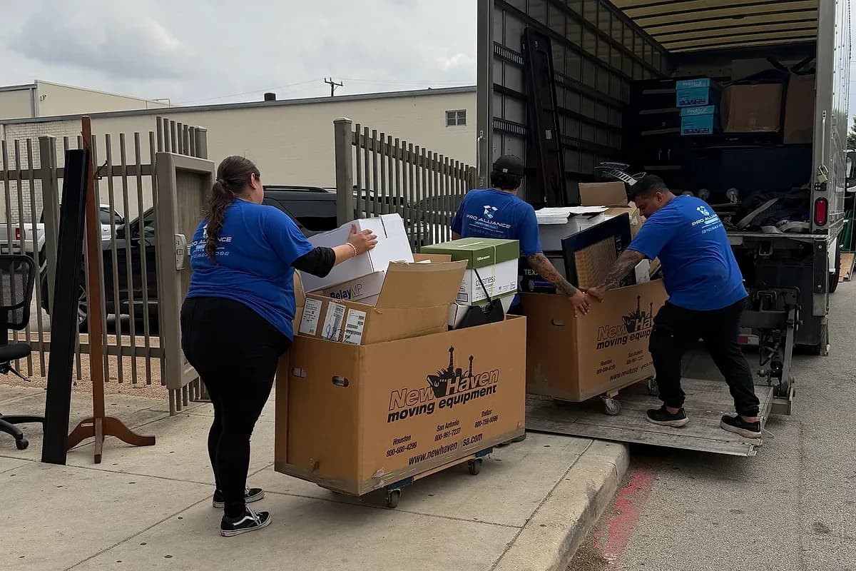 Boxes being loaded into a moving truck at a commercial site