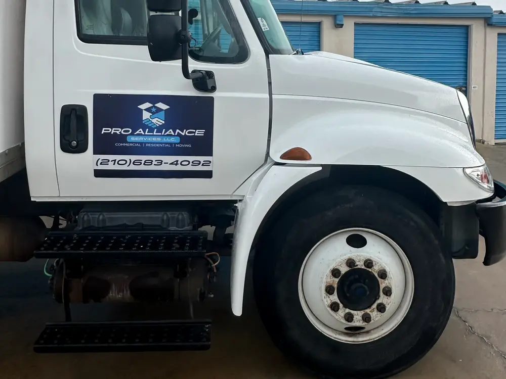 Pro Alliance moving truck door with the company phone number