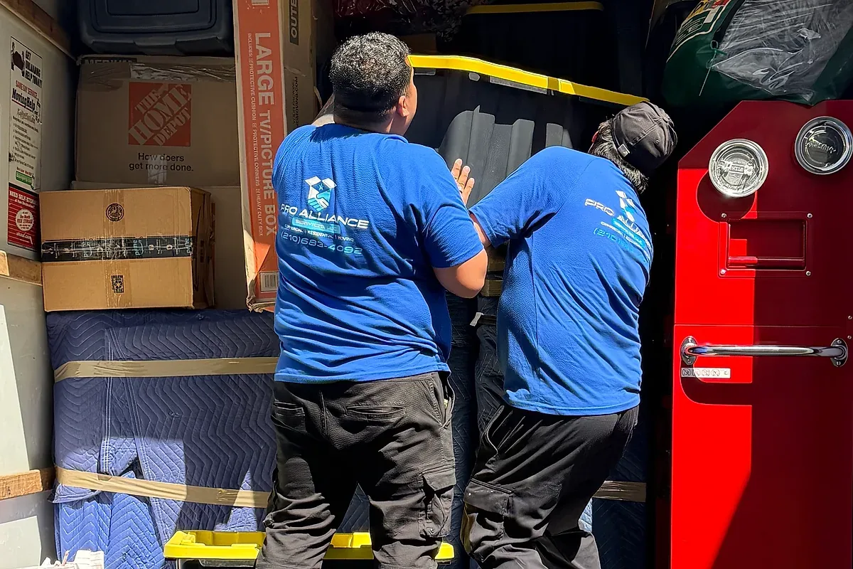 Cartons staged at the tail of a moving truck