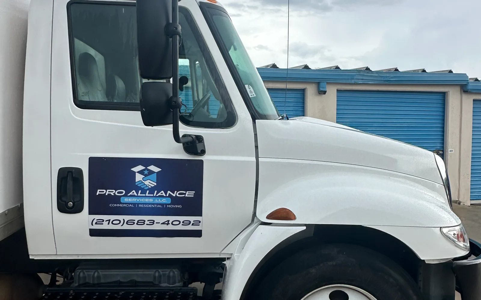 The cab door of a Pro Alliance truck with the company decal