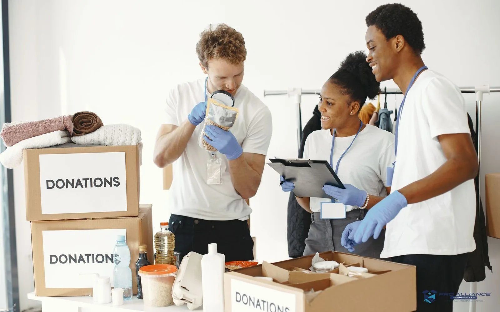 Labeled boxes sorted into keep and donate groups in a living room