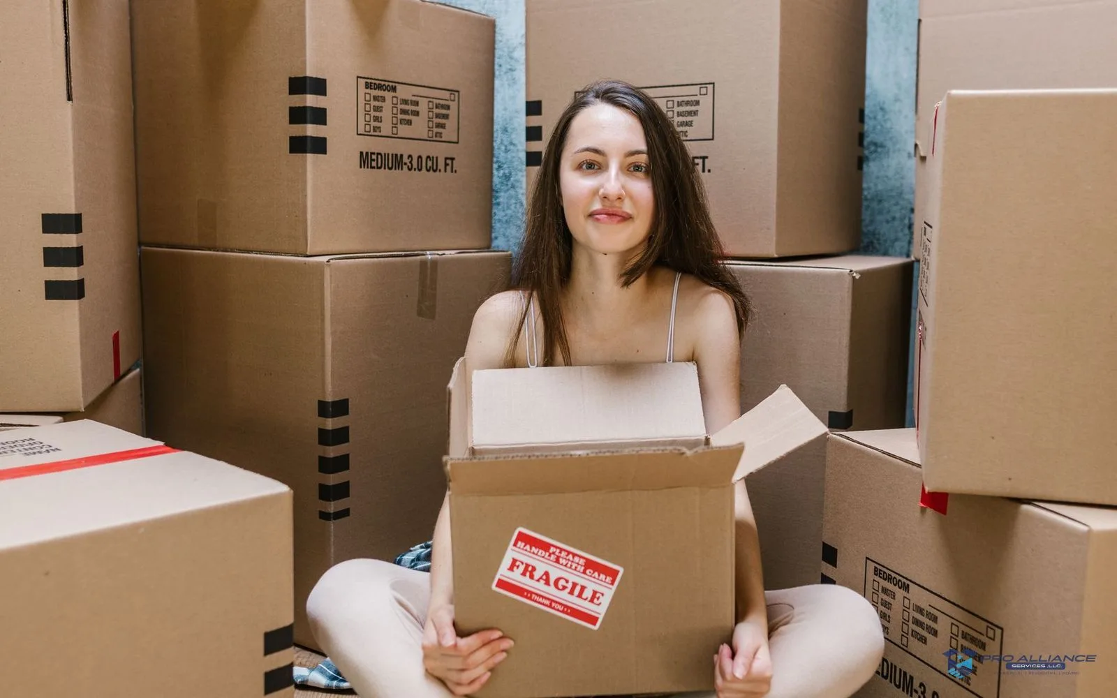 A room mid-pack with moving boxes in various stages of packing