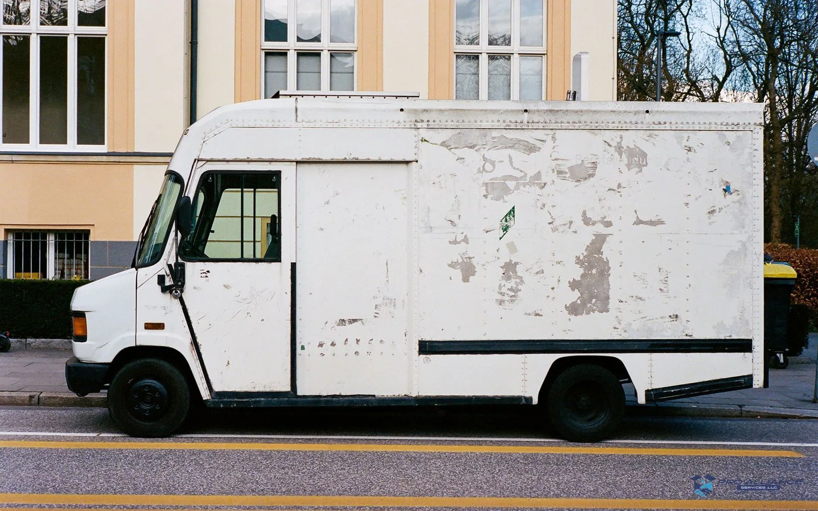 A rental box truck parked in front of a residential building