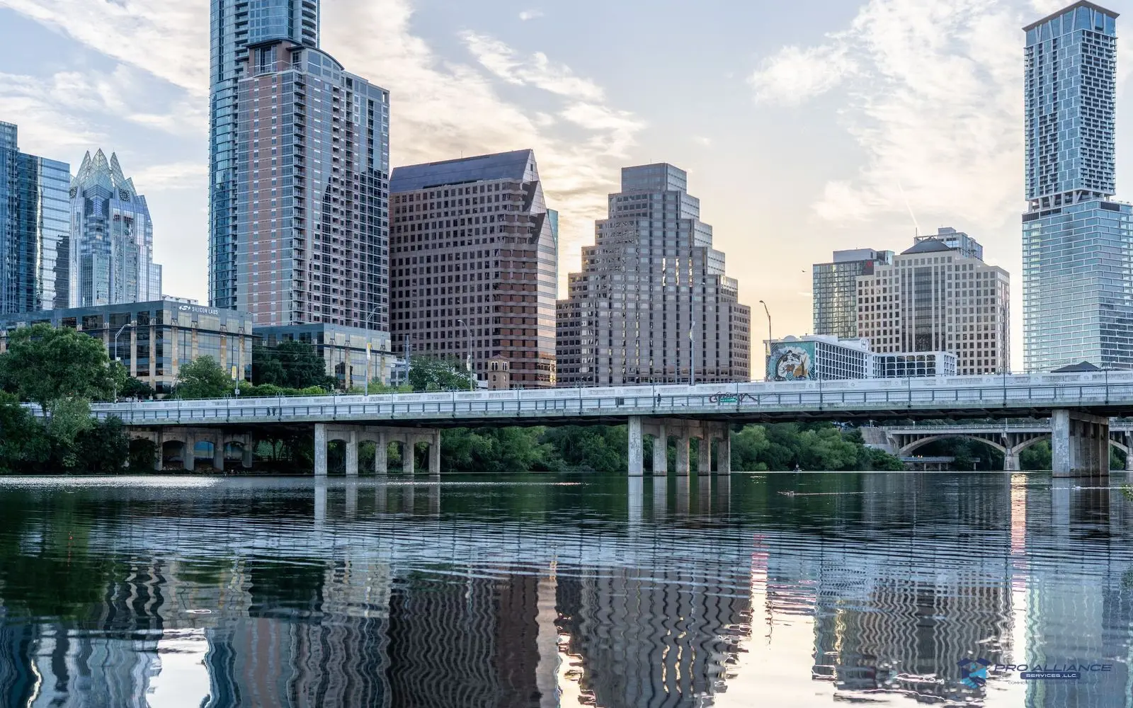 The downtown Austin skyline and the Congress Avenue bridge reflected in Lady Bird Lake