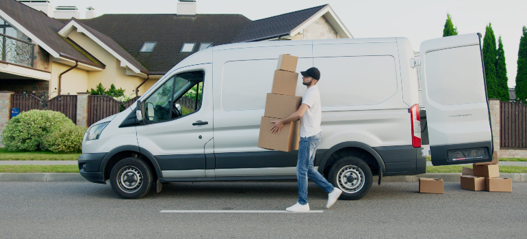 guy carrying moving boxes