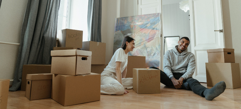 two people packing for a move with residential movers San Antonio
