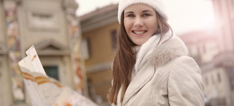 A woman holding a map