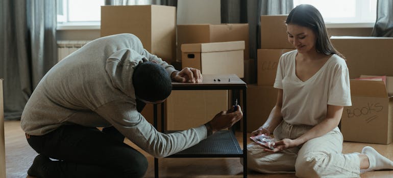 A couple unpacking in their new Terrell Hills home