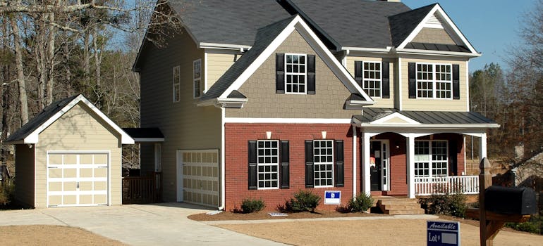 Grey and red wooden house