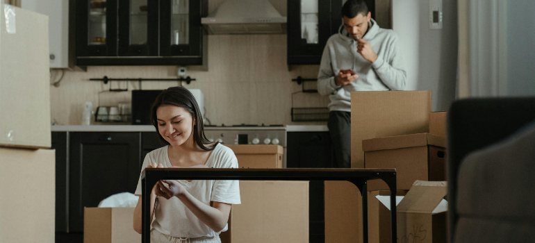 a couple packing for relocation