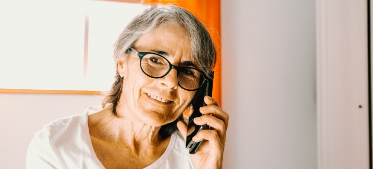 Person on the phone contacting movers Seguin TX locals recommend