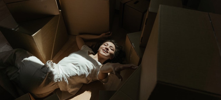 Woman who is happy because she managed to hire Hill Country movers​