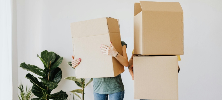 Family holding boxes.