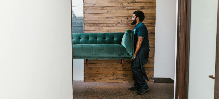 Lytle moving company carrying furniture.