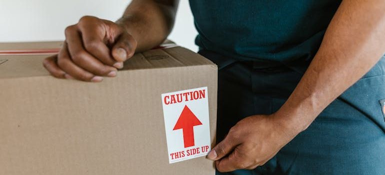 A packed moving box neatly sealed and labeled, illustrating how Uvalde movers handle all packing with care and attention to detail.
