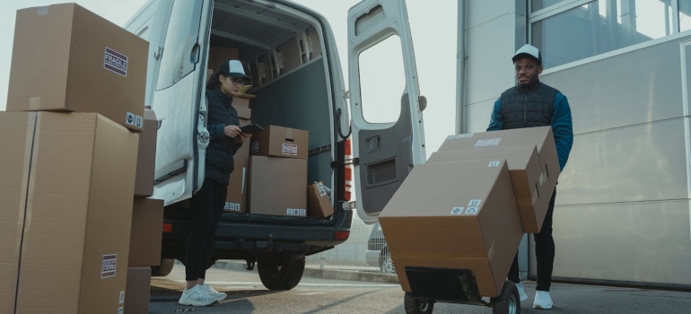 People unloading a van