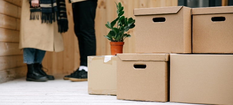 Brown Cardboard Boxes on Wooden Floor