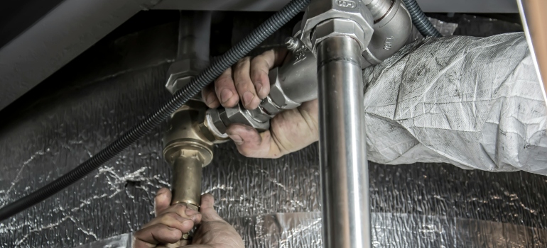 Plumber Installs Pipe Fittings
