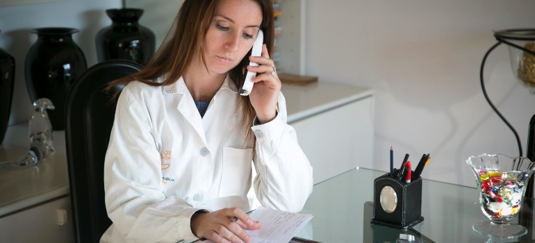 Administrative professional organizing paperwork and calls during private practice relocations in Seguin.