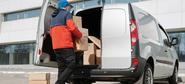 movers loading cardboard boxes