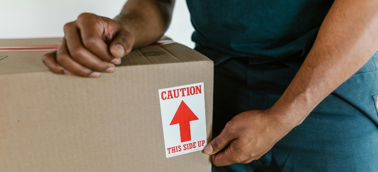 Sealed moving box prepared during how to pack small kitchen appliances for moving process.